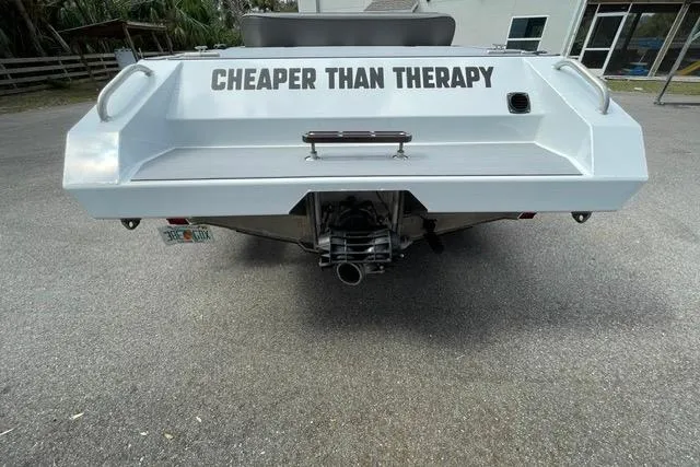 Slide: The Image of 2023 RSRRacecraft Rouge 16 boat with "Cheaper Than Therapy" text on the stern. - 8
