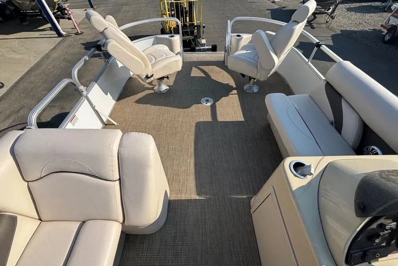 Slide: The Image of 2016 SunChaser Classic Fish 8522 DLX pontoon boat interior with beige seating and carpet. - 12