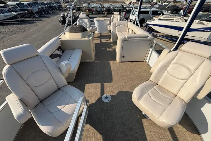 Slide: The Image of 2016 SunChaser Classic Fish 8522 DLX pontoon boat with beige seating and spacious deck. - 4
