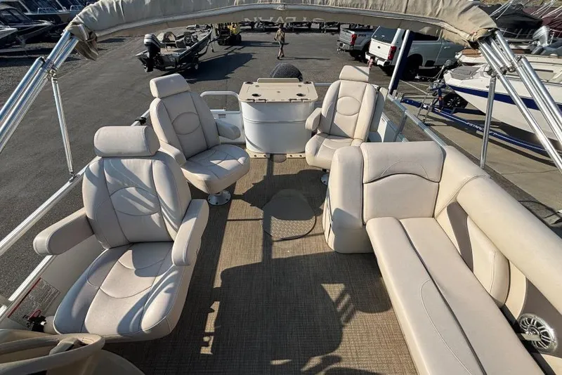 Slide: The Image of 2016 SunChaser Classic Fish 8522 DLX pontoon boat with beige seating and spacious deck. - 5