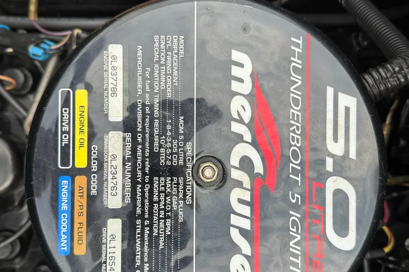 Slide: The Image of Engine cover of a 1998 Sea Ray 190 Bow Rider with MerCruiser 5.0L Thunderbolt ignition. - 15