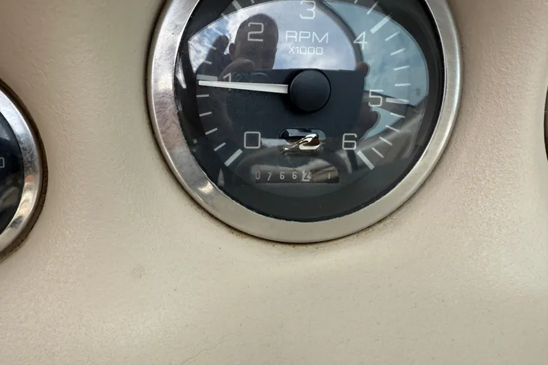 Slide: The Image of Close-up of 1998 Sea Ray 190 Bow Rider RPM gauge showing 7662 hours. - 16