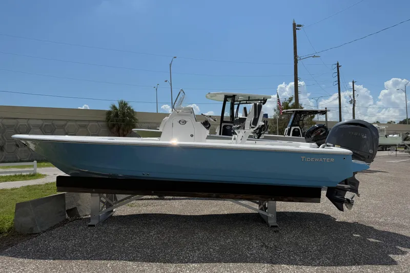 Slide: The Image of 2026 Tidewater 2110 Bay Max boat displayed outdoors on a sunny day. - 1