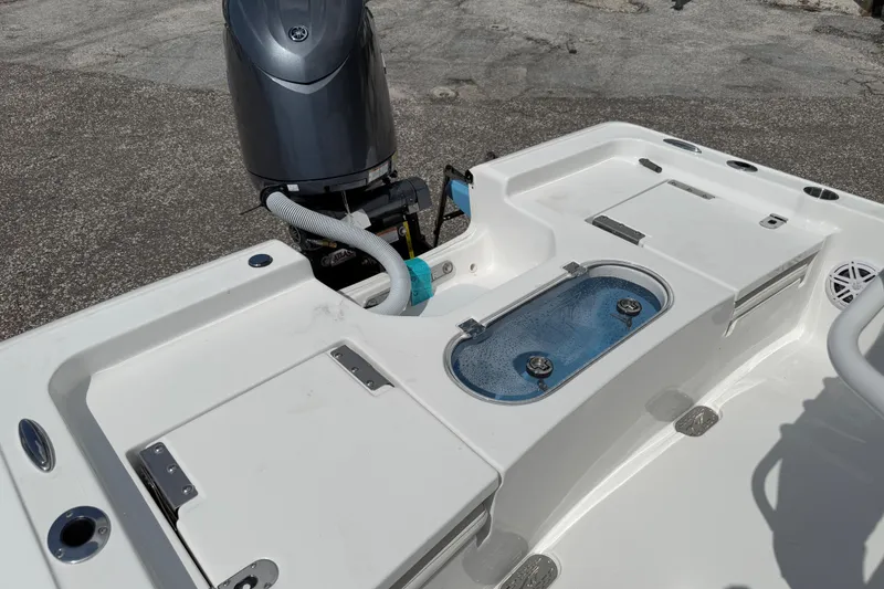 Slide: The Image of 2026 Tidewater 2110 Bay Max boat with motor and storage compartments. - 8