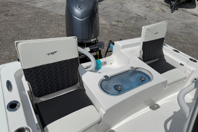 Slide: The Image of 2026 Tidewater 2110 Bay Max boat interior with seating and livewell. - 9