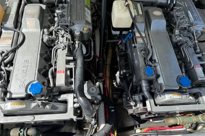 Slide: The Image of Twin 24-valve engines in an Apache 36CC, 2005 model, with visible components and labels. - 14