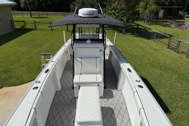 Slide: The Image of 2005 Apache 36CC boat with Garmin equipment, featuring spacious seating and sleek design. - 22