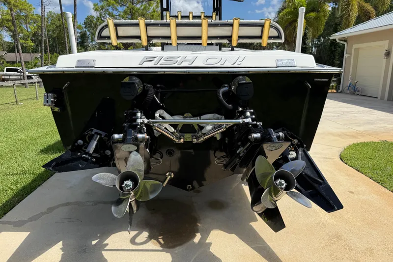 Slide: The Image of Rear view of a 2005 Apache 36CC boat with dual propellers on a sunny day. - 8