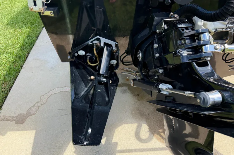 Slide: The Image of Close-up of a 2005 Apache 36CC boat engine components on a concrete surface. - 9