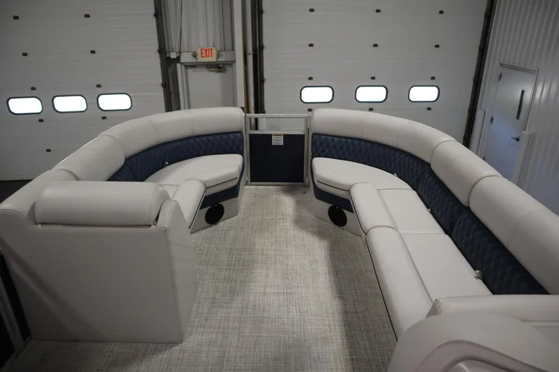 Slide: The Image of 2023 Nepallo 20 CW Pontoon interior with luxurious seating in a spacious garage. - 10