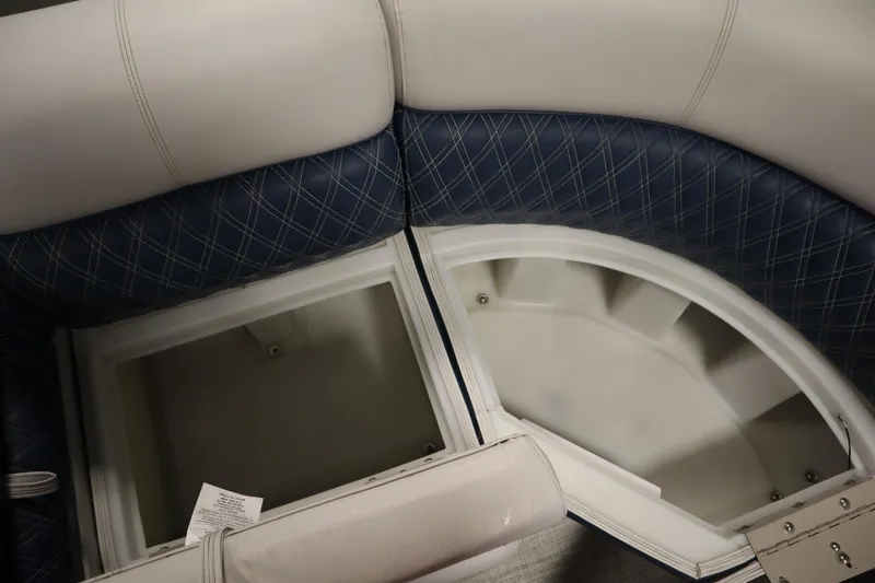 Slide: The Image of 2023 Nepallo 20 CW Pontoon seating with storage compartments, featuring blue and white upholstery. - 13