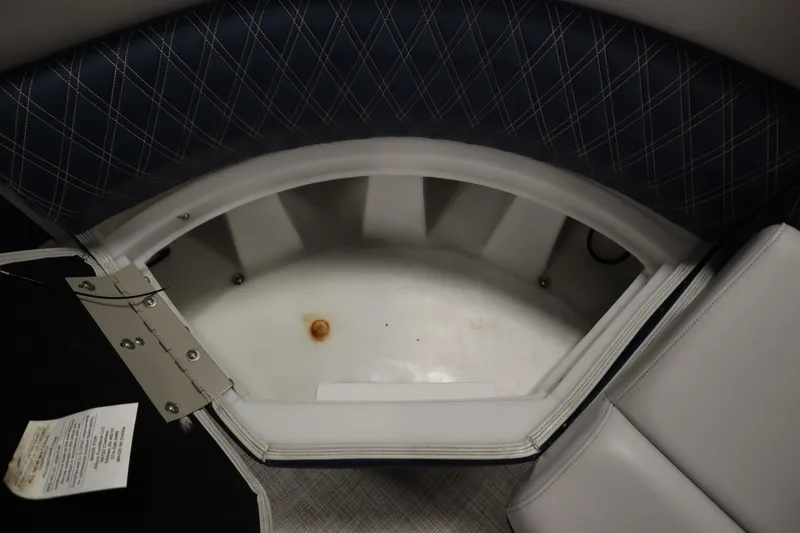 Slide: The Image of Open storage compartment in 2023 Nepallo 20 CW Pontoon boat with cushioned seating. - 16