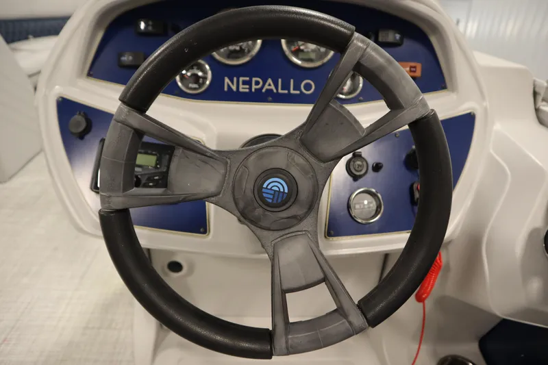 Slide: The Image of Steering wheel of 2023 Nepallo 20 CW Pontoon boat with dashboard controls. - 19