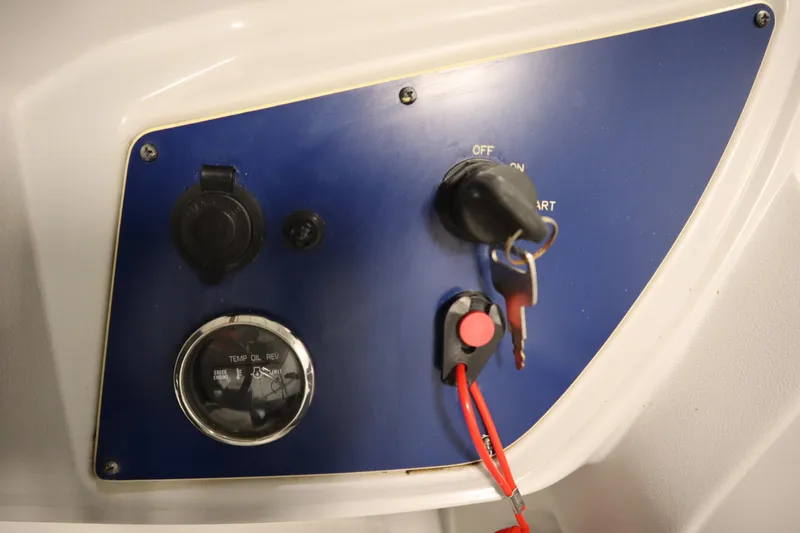 Slide: The Image of Control panel of 2023 Nepallo 20 CW Pontoon with ignition key and gauge. - 22