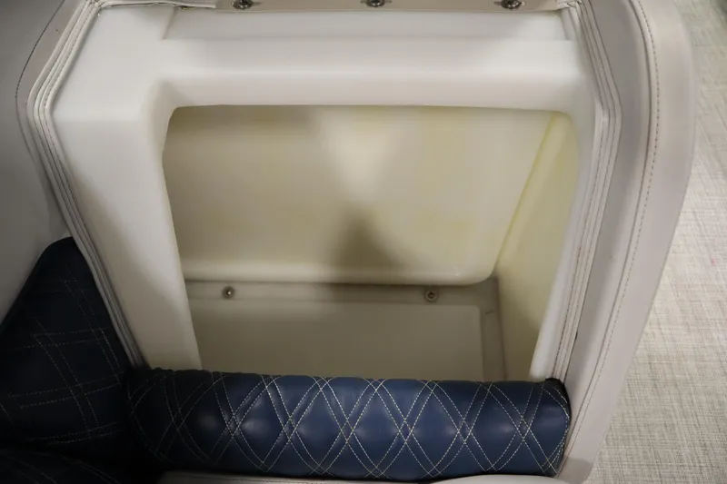 Slide: The Image of 2023 Nepallo 20 CW Pontoon seat storage compartment with blue and white upholstery. - 28