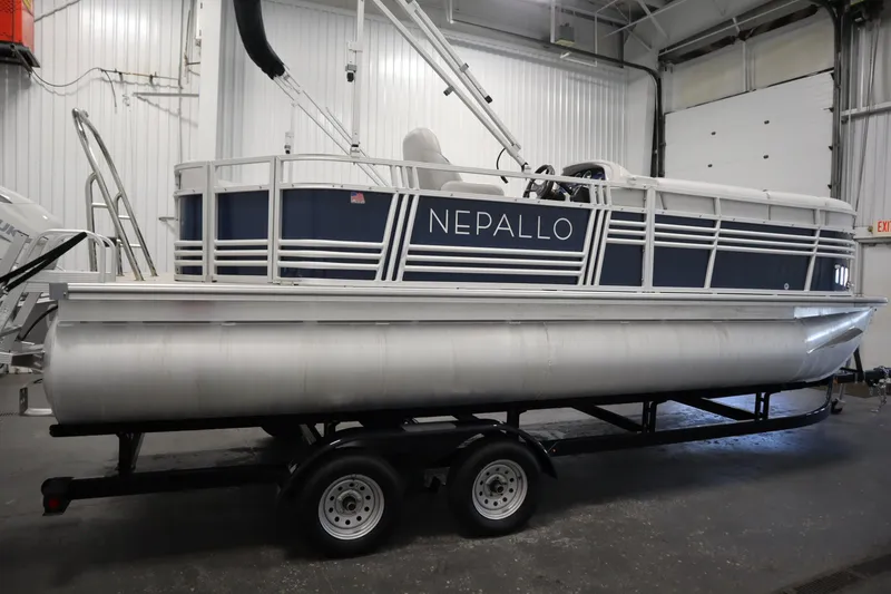 Slide: The Image of 2023 Nepallo 20 CW Pontoon boat on trailer in indoor storage facility. - 3
