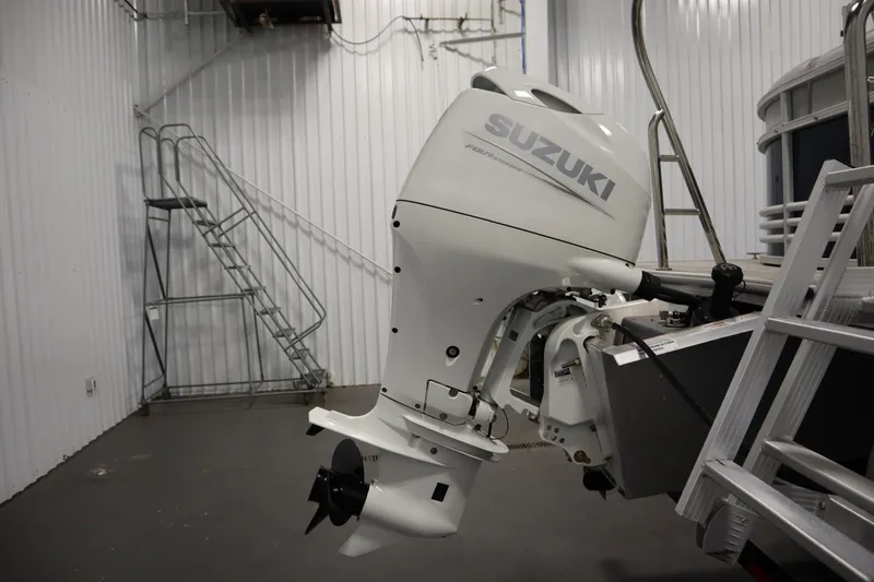 Slide: The Image of 2023 Nepallo 20 CW Pontoon with Suzuki outboard motor in a storage facility. - 35