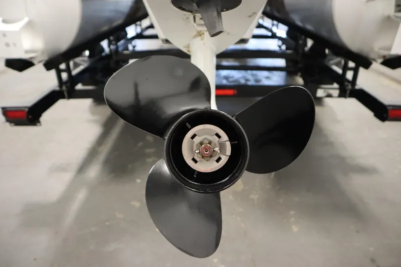Slide: The Image of Close-up of a 2023 Nepallo 20 CW Pontoon boat propeller in a garage. - 37