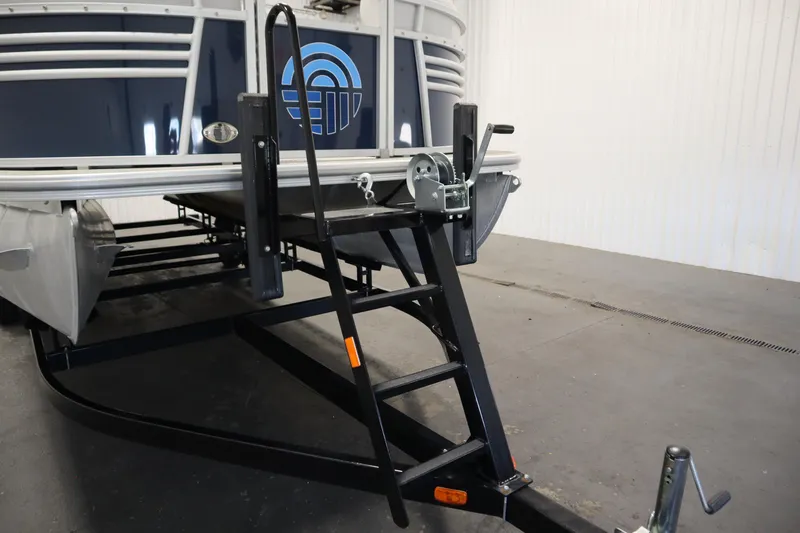 Slide: The Image of 2023 Nepallo 20 CW Pontoon on trailer, featuring a sturdy ladder and winch system. - 39
