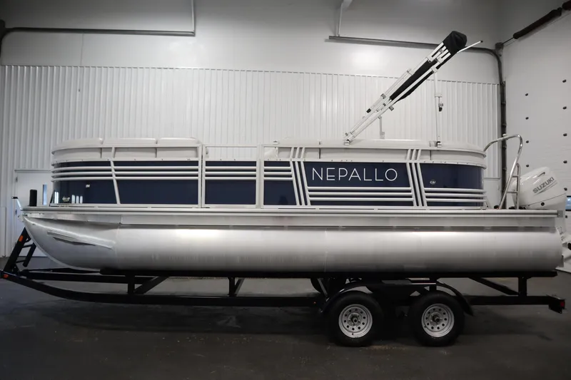 Slide: The Image of 2023 Nepallo 20 CW Pontoon boat on trailer in indoor setting. - 7