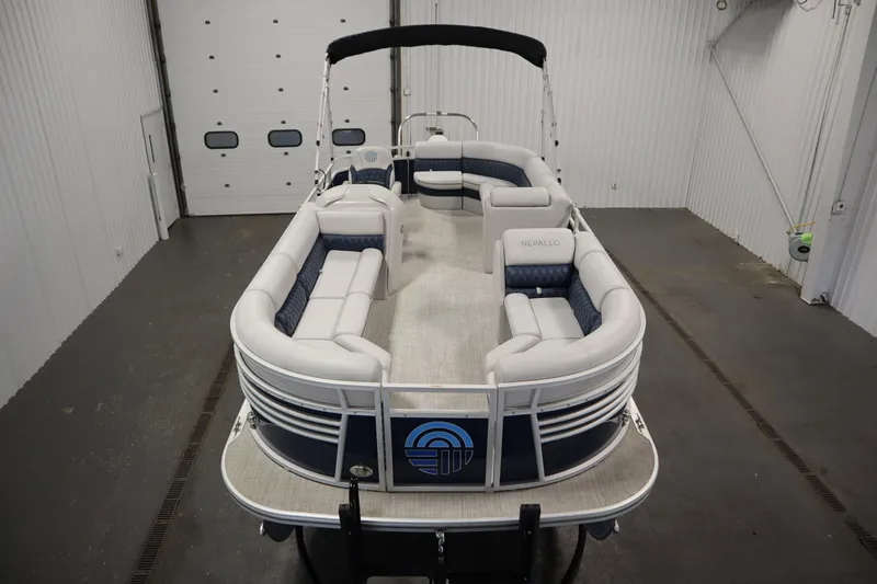 Slide: The Image of 2023 Nepallo 20 CW Pontoon boat with spacious seating in a showroom. - 8