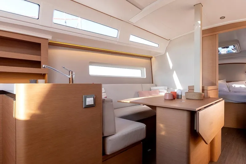 Slide: The Image of Modern interior of 2025 Jeanneau Sun Odyssey 380 yacht with sleek wood finishes. - 25