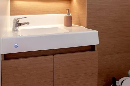 Slide: The Image of Modern bathroom sink in 2025 Jeanneau Sun Odyssey 380 yacht interior. - 36