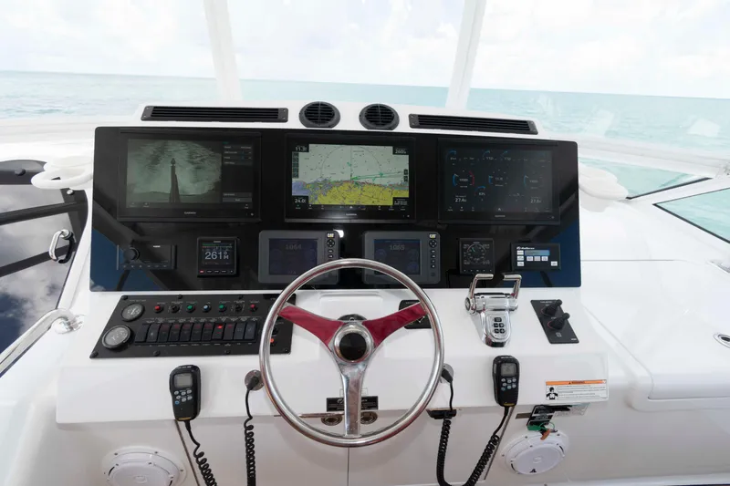Slide: The Image of Helm of 2009 Hatteras 60 Motor Yacht with advanced navigation displays and controls. - 22