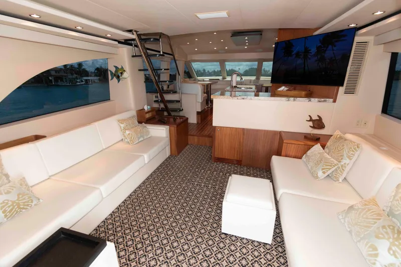 Slide: The Image of Luxurious interior of 2009 Hatteras 60 Motor Yacht with elegant seating and modern amenities. - 39