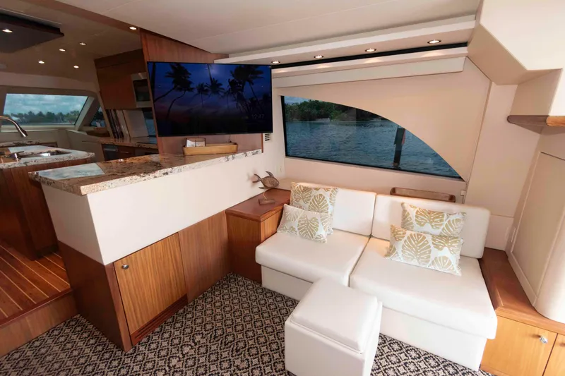Slide: The Image of Luxurious interior of 2009 Hatteras 60 Motor Yacht with elegant seating and modern decor. - 41
