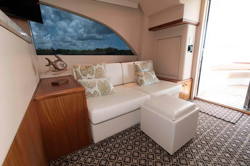 Slide: The Image of Luxurious interior of 2009 Hatteras 60 Motor Yacht with elegant seating and scenic window view. - 42