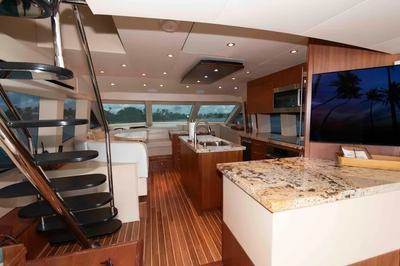 Slide: The Image of Luxurious interior of 2009 Hatteras 60 Motor Yacht with modern kitchen and elegant design. - 46