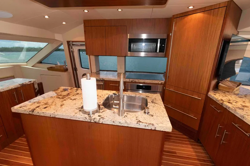 Slide: The Image of Luxurious kitchen interior of 2009 Hatteras 60 Motor Yacht with granite countertops. - 48