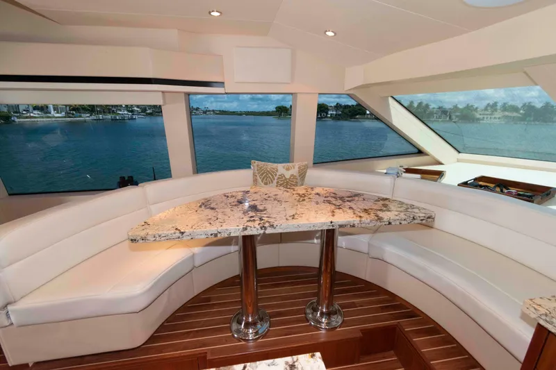 Slide: The Image of Luxurious interior of 2009 Hatteras 60 Motor Yacht with elegant seating and ocean view. - 51