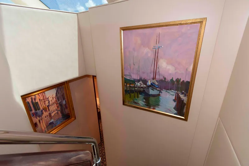 Slide: The Image of Interior of 2009 Hatteras 60 Motor Yacht with nautical paintings on walls. - 58