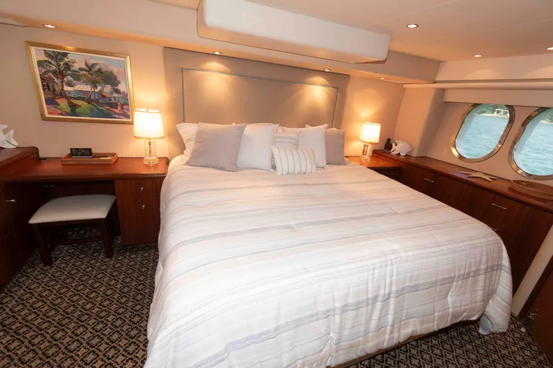 Slide: The Image of Luxurious bedroom interior of 2009 Hatteras 60 Motor Yacht with elegant decor and ocean view. - 60