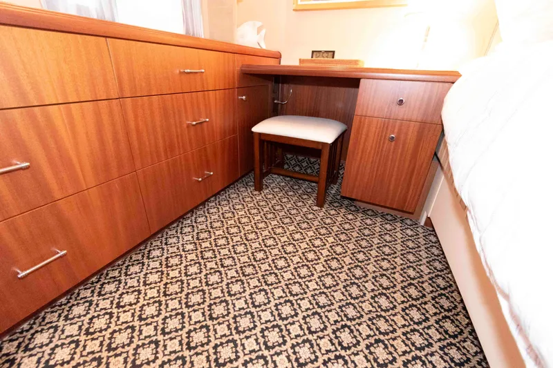 Slide: The Image of Luxurious wood interior of 2009 Hatteras 60 Motor Yacht with patterned carpet. - 63