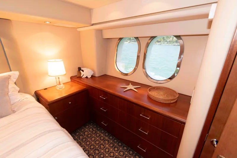 Slide: The Image of Luxurious cabin interior of 2009 Hatteras 60 Motor Yacht with porthole windows. - 64