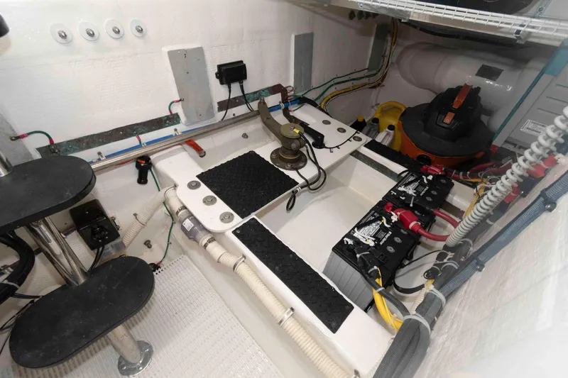 Slide: The Image of Engine room of 2009 Hatteras 60 Motor Yacht with batteries and wiring. - 85
