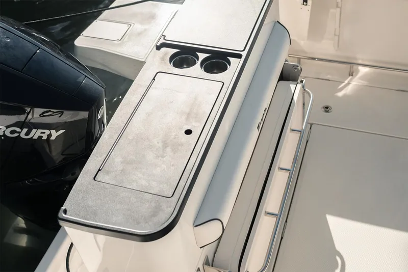 Slide: The Image of Manufacturer Provided Image: 2025 Bayliner Trophy T25 Pilothouse boat deck with Mercury engine and storage compartments. - 6