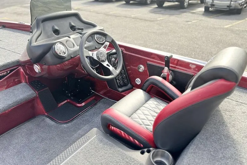 Slide: The Image of 2026 Phoenix 721 ZXL boat interior with steering wheel and cushioned seat. - 11