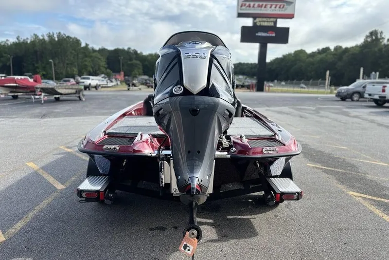 Slide: The Image of 2026 Phoenix 721 ZXL boat with powerful engine, parked outdoors on a sunny day. - 7