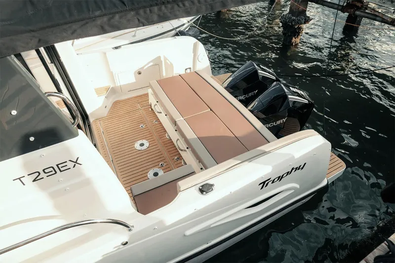 Slide: The Image of Manufacturer Provided Image: 2025 Bayliner Trophy T29 Explorer boat with dual Mercury engines docked on water. - 2