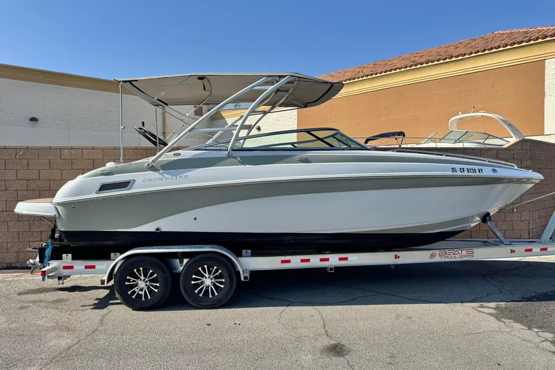 The Image of 2007 Crownline 270 BR boat on trailer, parked outdoors, side view. - 0