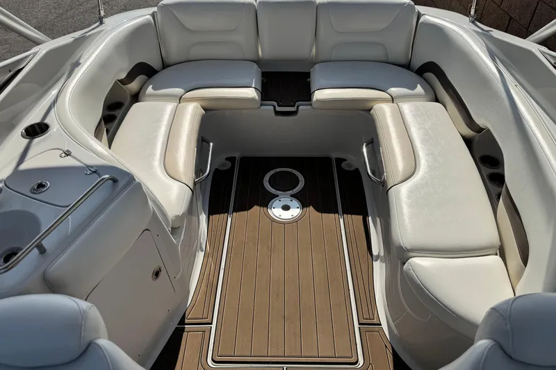 Slide: The Image of Luxurious seating area on a 2007 Crownline 270 BR boat with elegant wood flooring. - 17