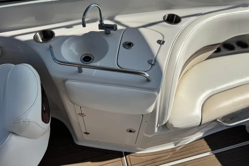 Slide: The Image of 2007 Crownline 270 BR boat interior with sink and seating area. - 18