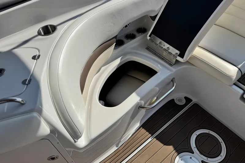Slide: The Image of 2007 Crownline 270 BR boat interior with seating and storage compartment. - 22