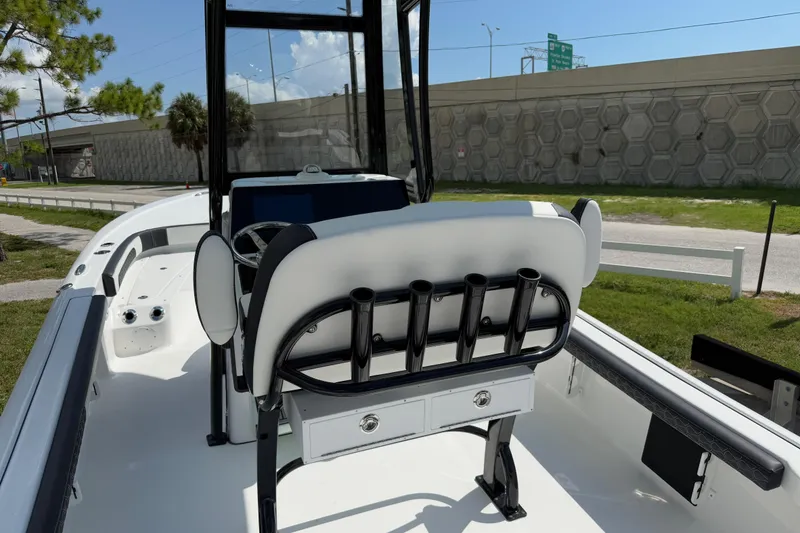 Slide: The Image of 2026 Tidewater 2300 Carolina Bay boat interior with rod holders and seating. - 6