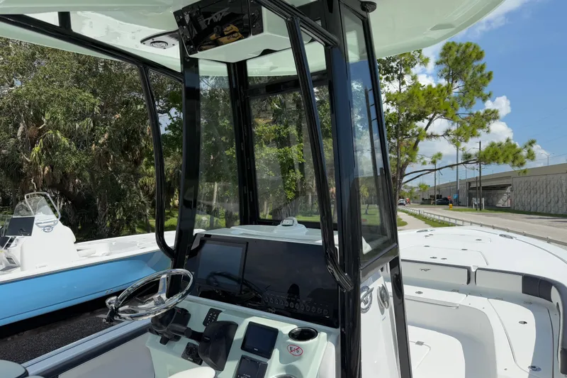 Slide: The Image of 2026 Tidewater 2300 Carolina Bay boat interior with modern console and steering wheel. - 9