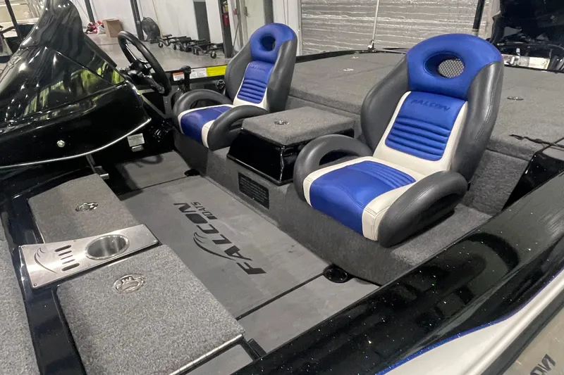 Slide: The Image of Interior of 2021 Falcon F21 boat with blue and gray seating. - 15